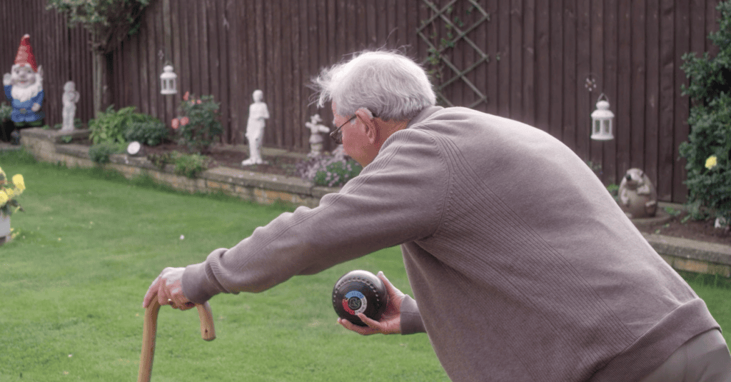 Gordon playing bowls in his garden