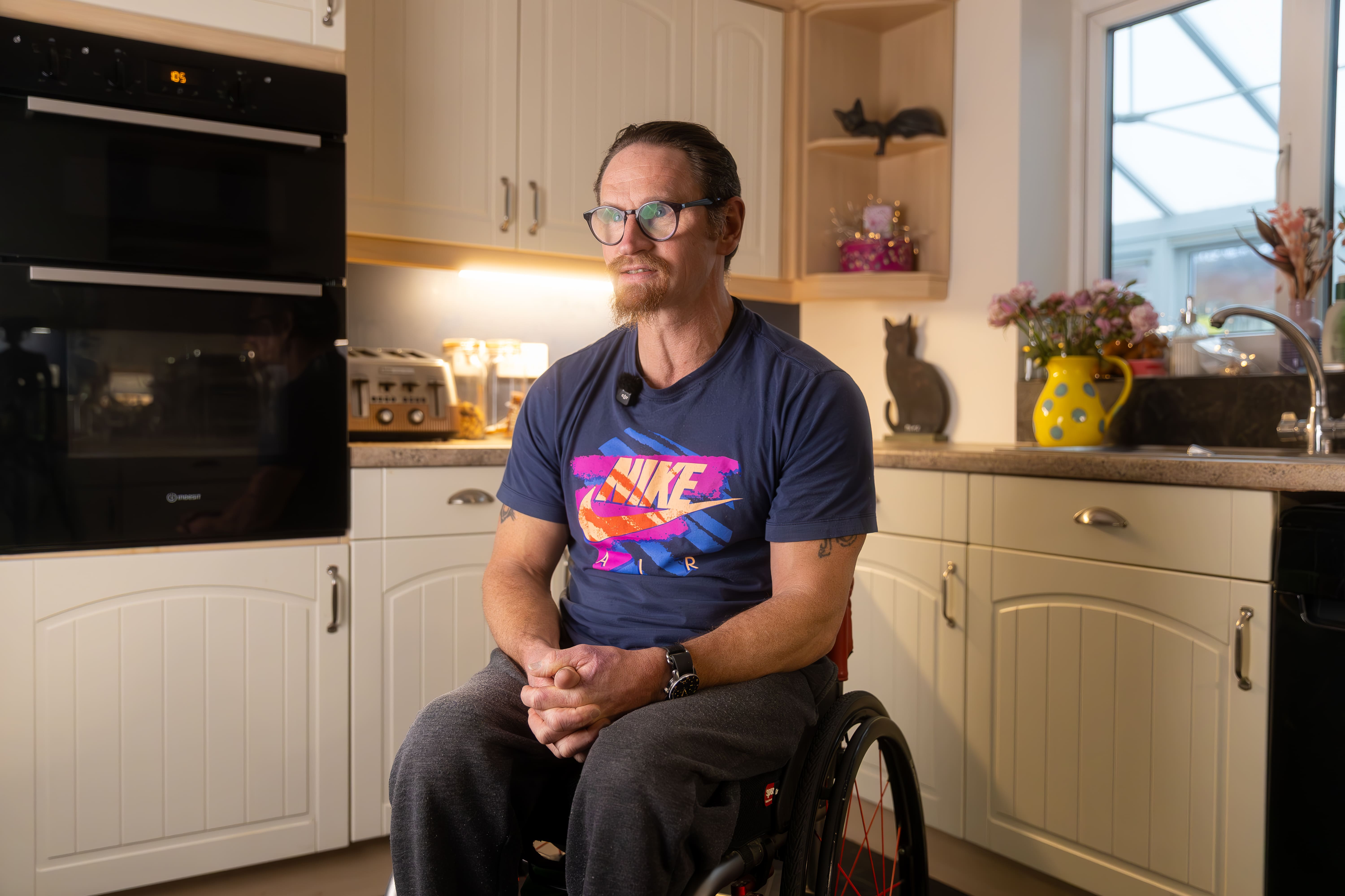 Our Client Ian in a wheelchair