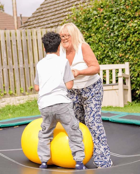 Michelle and Charlie on a trampoline