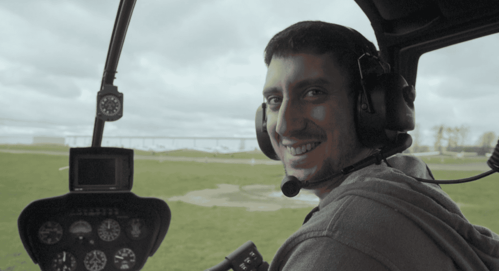 Sam smiling in helicopter