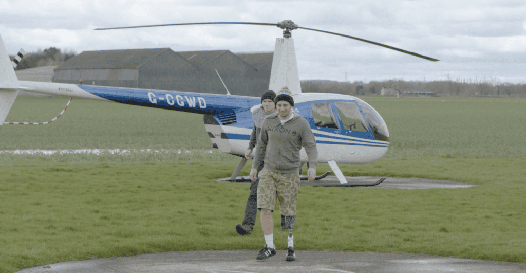 Sam walking from helicopter