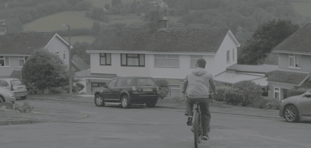 Stuart cycling down the road
