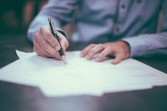 Person signing legal paperwork