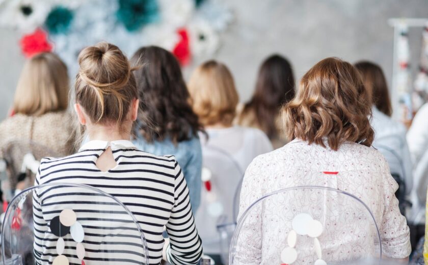 Audience attending a conference presentation