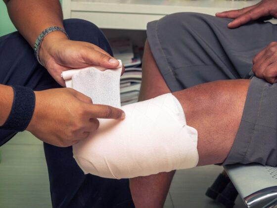 Bandage being wrapped around leg injury