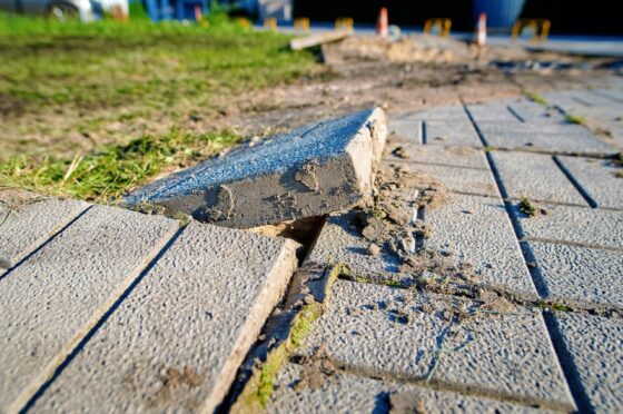 Broken paving slab causing trip hazard