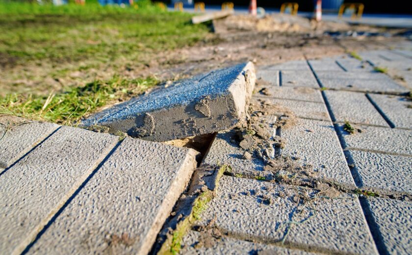 Broken paving slab causing trip hazard