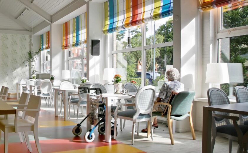 Care home dining room with mobility aid