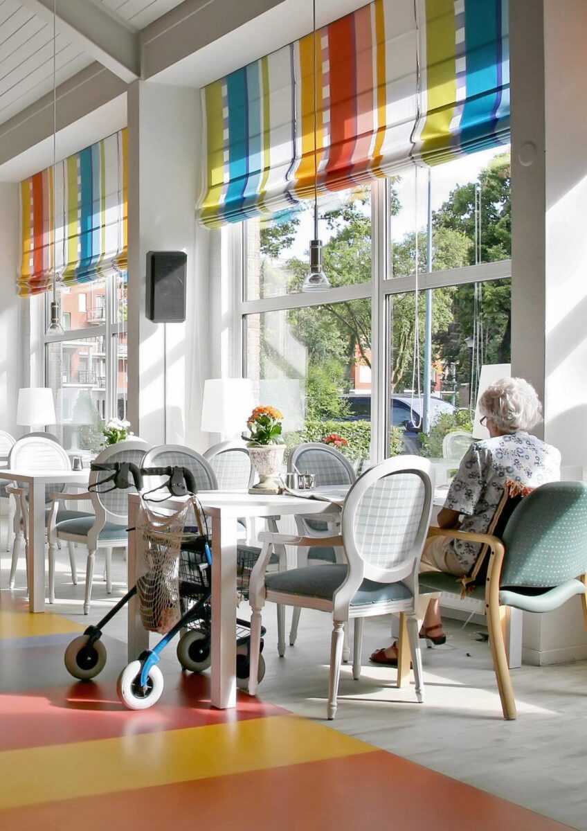 Care home dining room with mobility aid