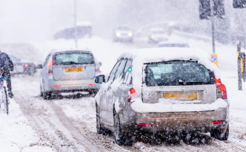 Cars driving through heavy snow