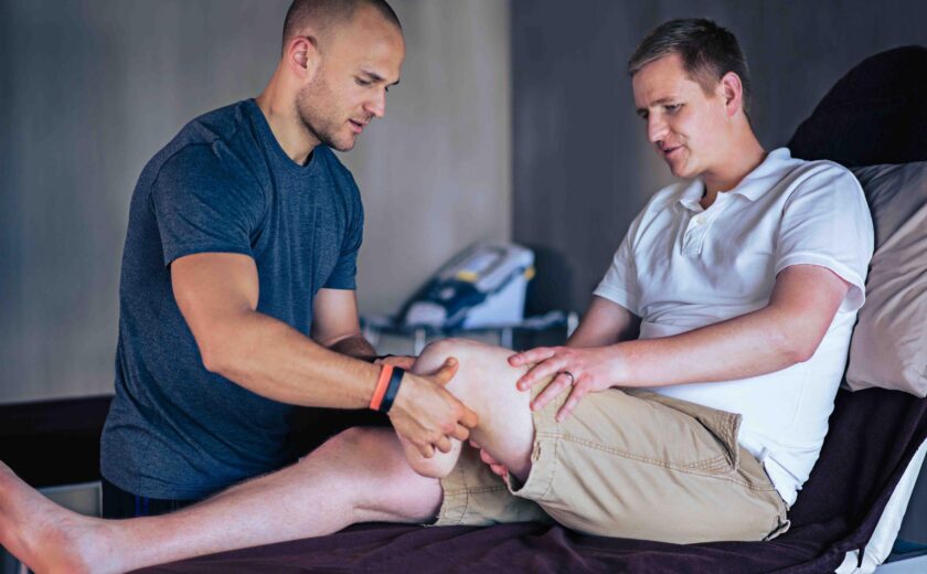 Clinician examining amputee's residual limb