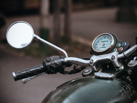 Close-up of motorcycle handlebars and mirror