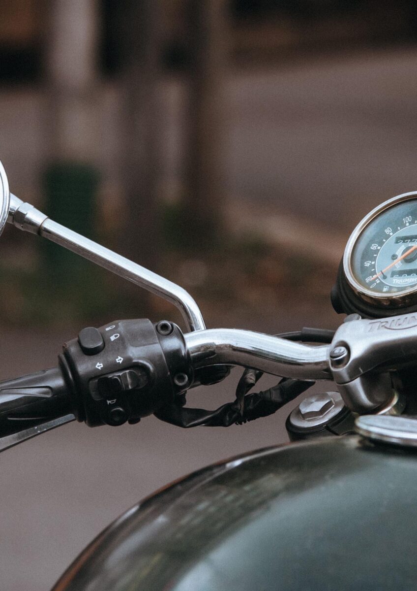 Close-up of motorcycle handlebars and mirror