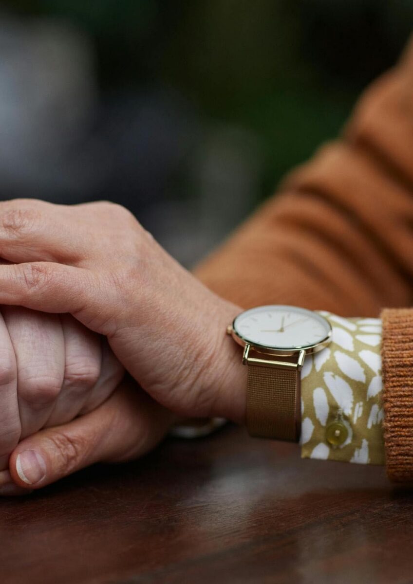 Close-up of one person comforting another