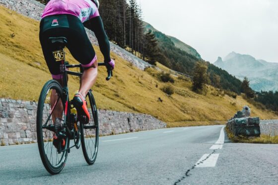Cyclist climbing mountain road