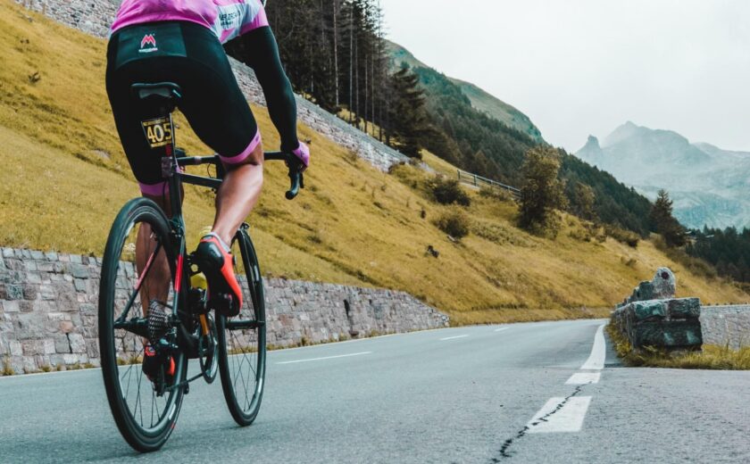 Cyclist climbing mountain road