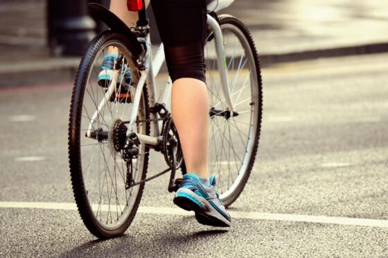 Cyclist waiting at road junction