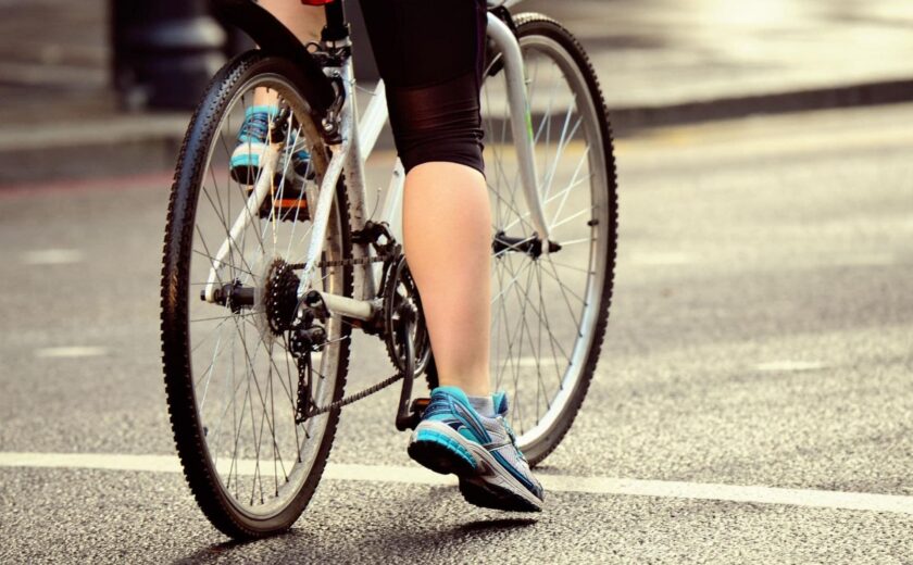 Cyclist waiting at road junction