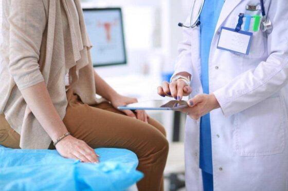 Doctor discussing notes with patient
