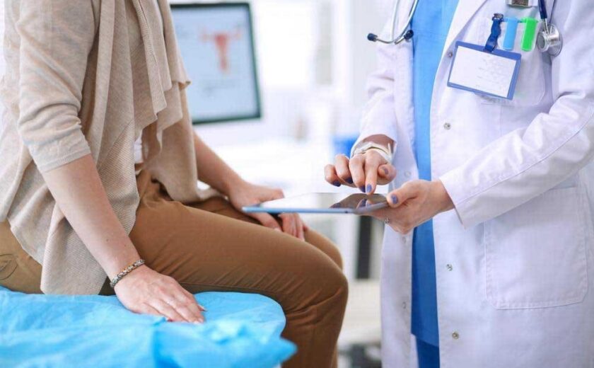 Doctor discussing notes with patient