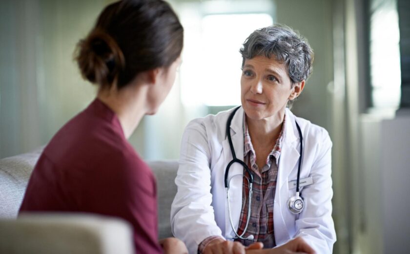 Doctor speaking with patient during consultation