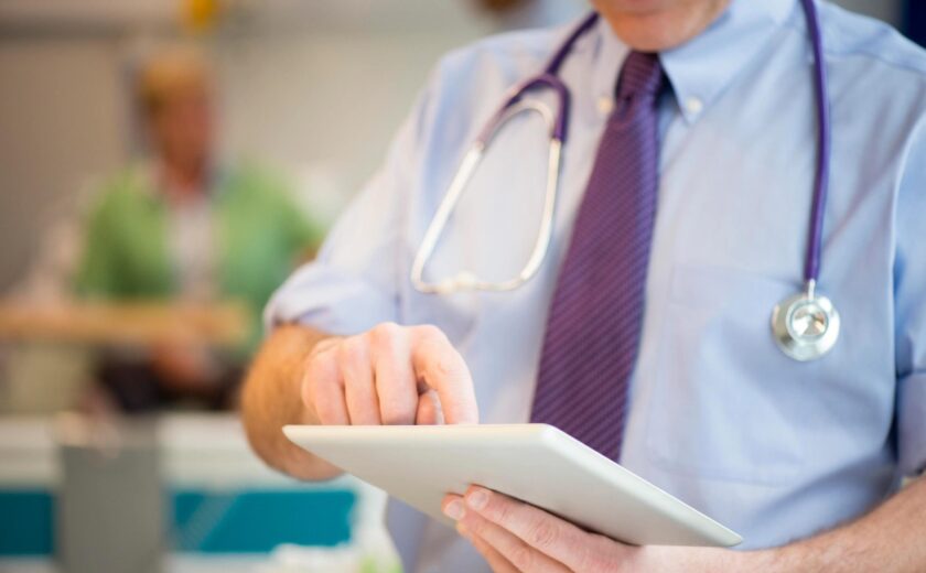 Doctor using tablet in hospital