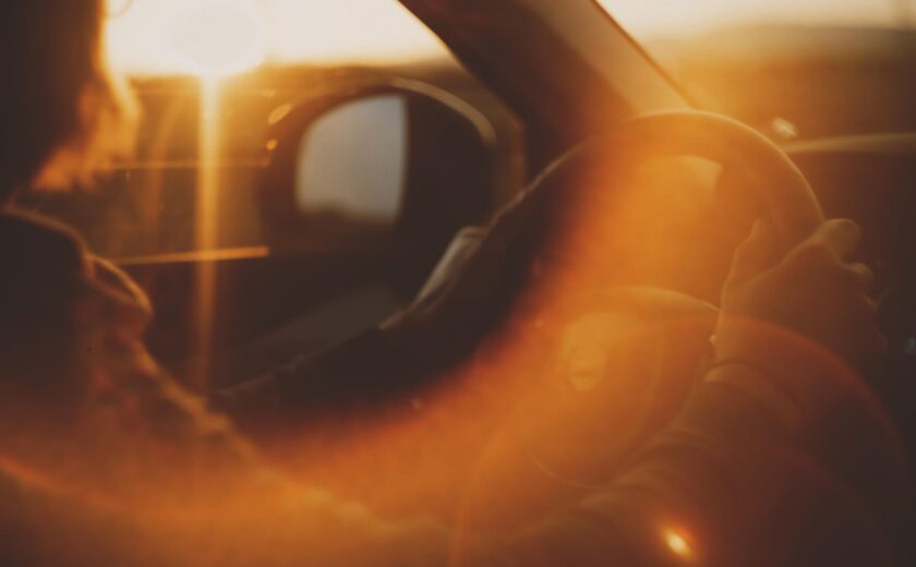 Driving car in sun