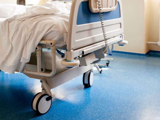 Empty hospital bed on ward