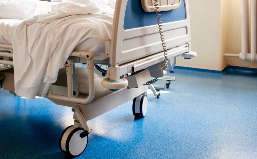 Empty hospital bed on ward