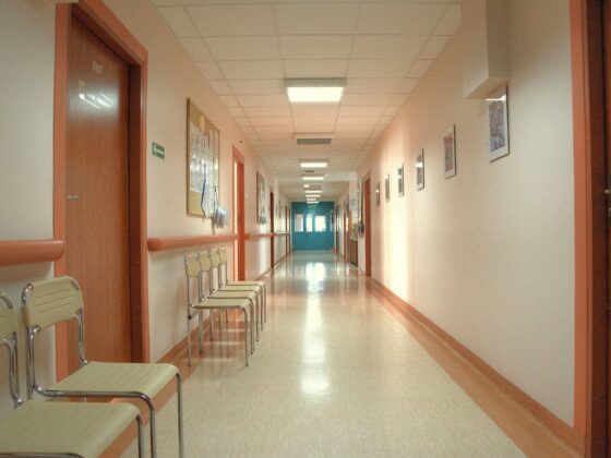 Empty hospital corridor with chairs