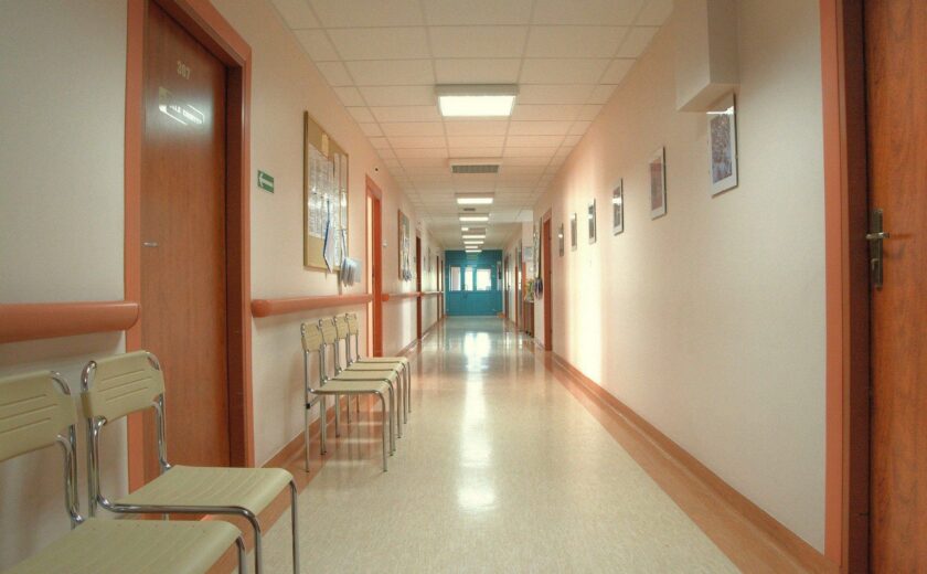 Empty hospital corridor with chairs