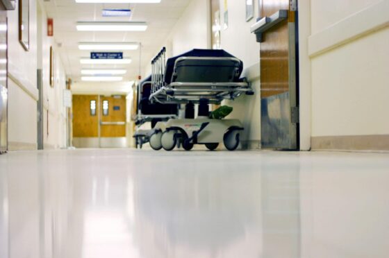 Empty hospital corridor with trolley