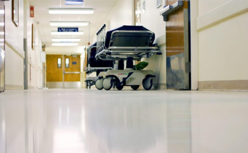 Empty hospital corridor with trolley