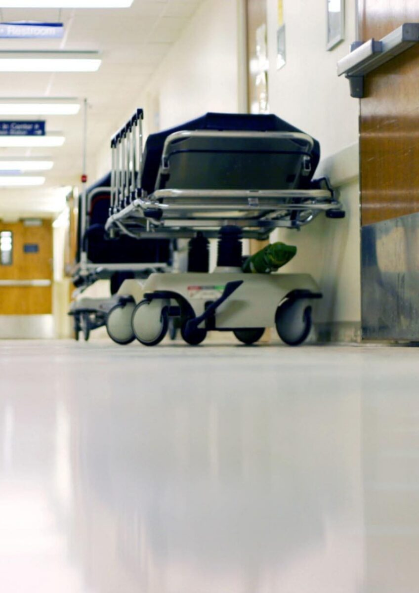 Empty hospital corridor with trolley