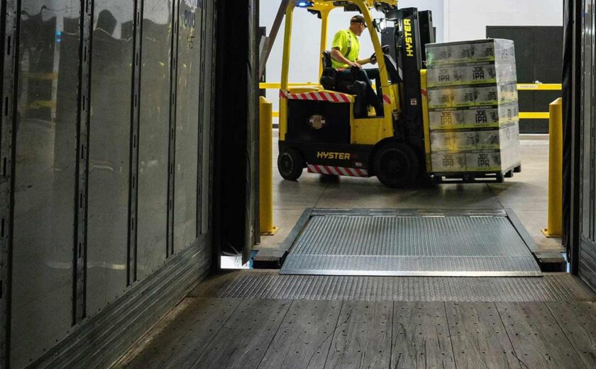 Forklift loading pallets inside warehouse