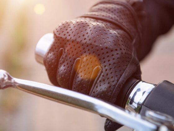 Gloved hand on motorcycle brake lever