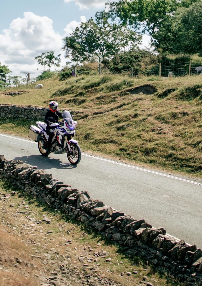 Group of motorcyclists riding through countryside