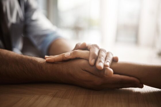 Hand holding reassurance