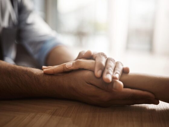 Hand holding reassurance