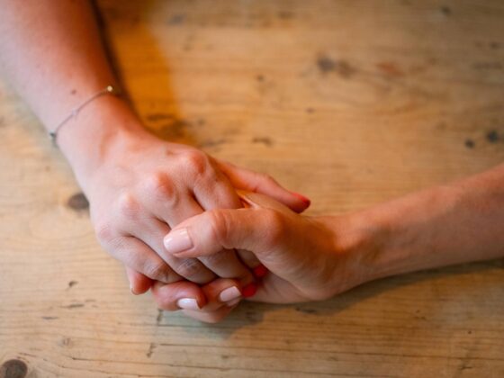 Holding hands being reassured