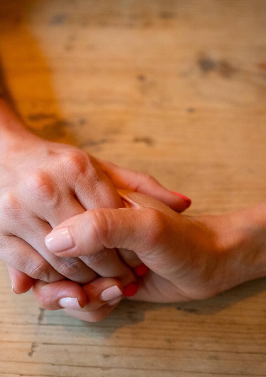 Holding hands being reassured