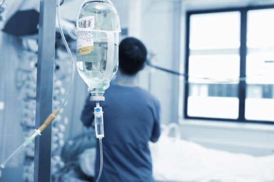 IV drip beside hospital patient bed