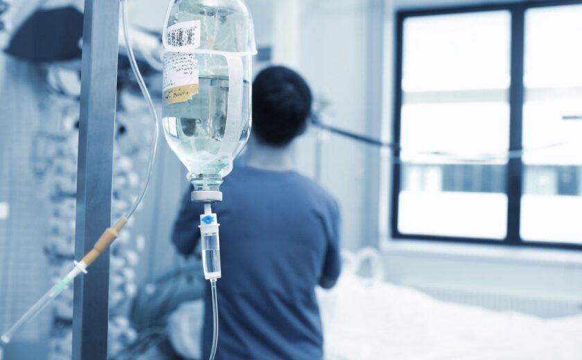 IV drip beside hospital patient bed