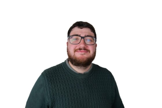 Kieran Smith smiling in professional headshot