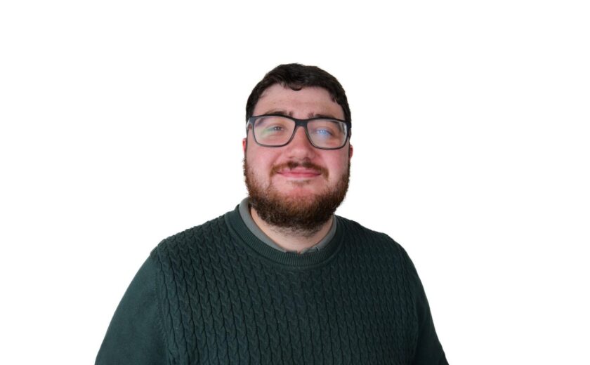 Kieran Smith smiling in professional headshot