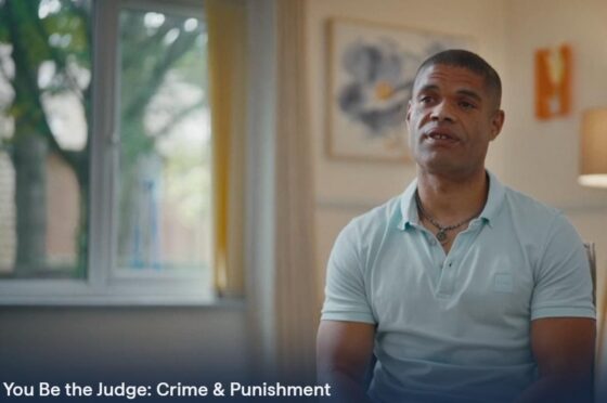 Man speaking in You Be the Judge video still