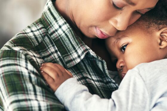 Mother hugging child