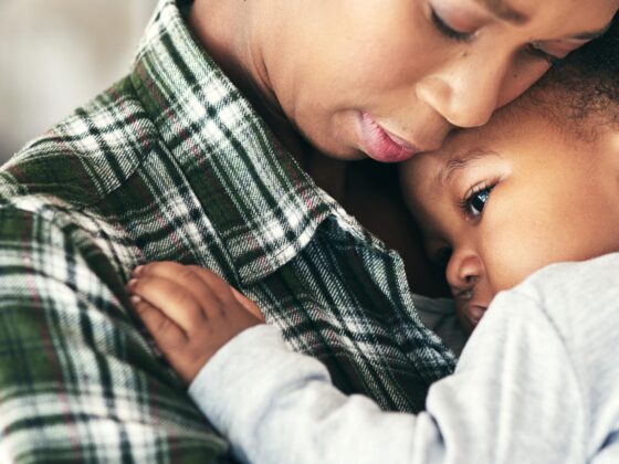 Mother hugging child