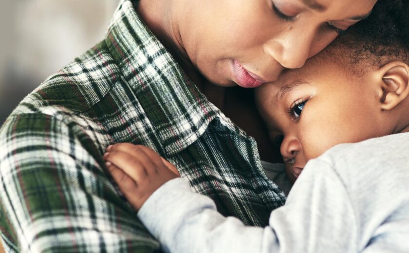 Mother hugging child
