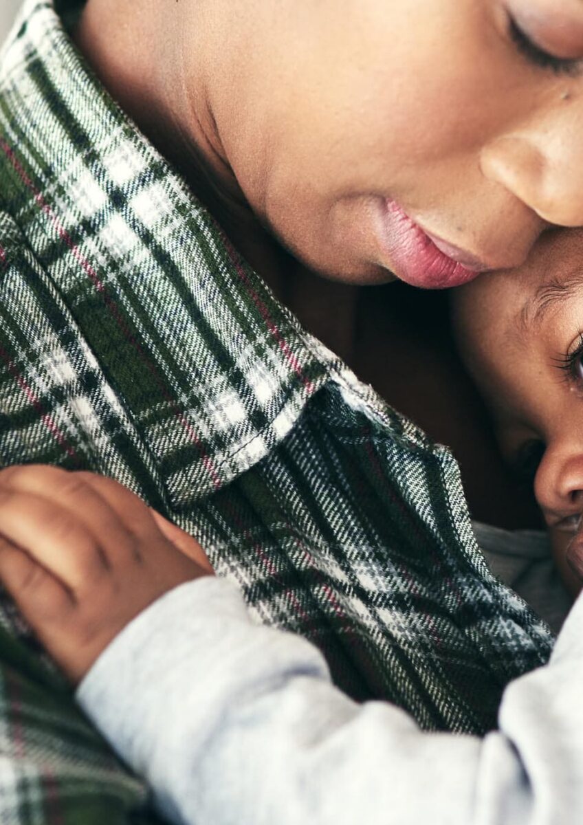 Mother hugging child